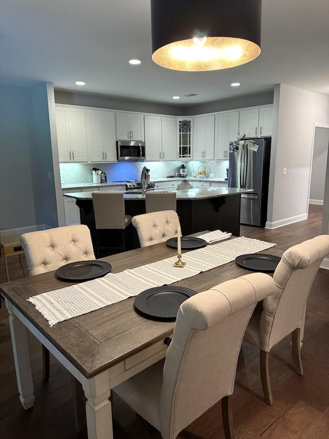 107 Auxley Ct, White House, TN 37188 - dining area featuring baseboards, dark wood finished floors, and recessed lighting