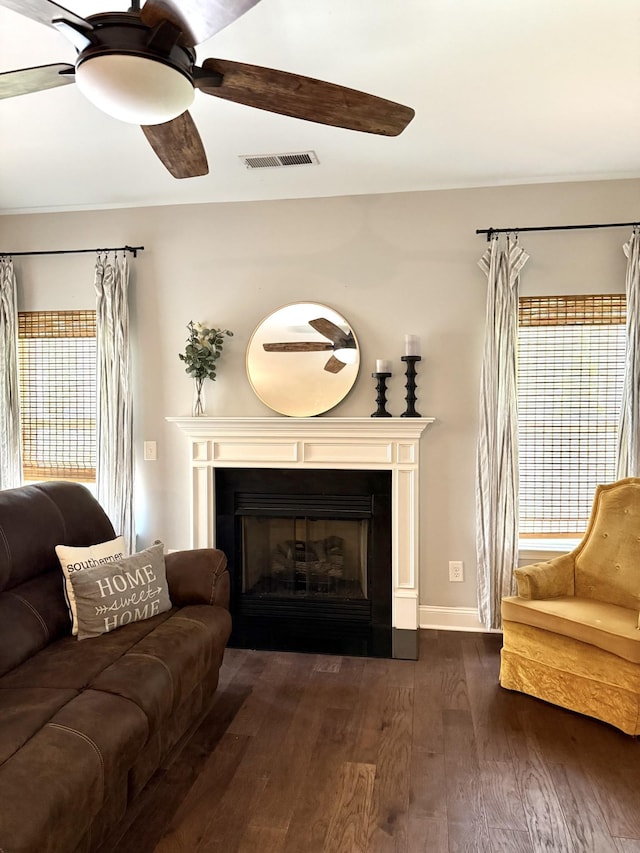 107 Auxley Ct, White House, TN 37188 - living room featuring dark wood-style floors, a fireplace, ceiling fan, and plenty of natural light