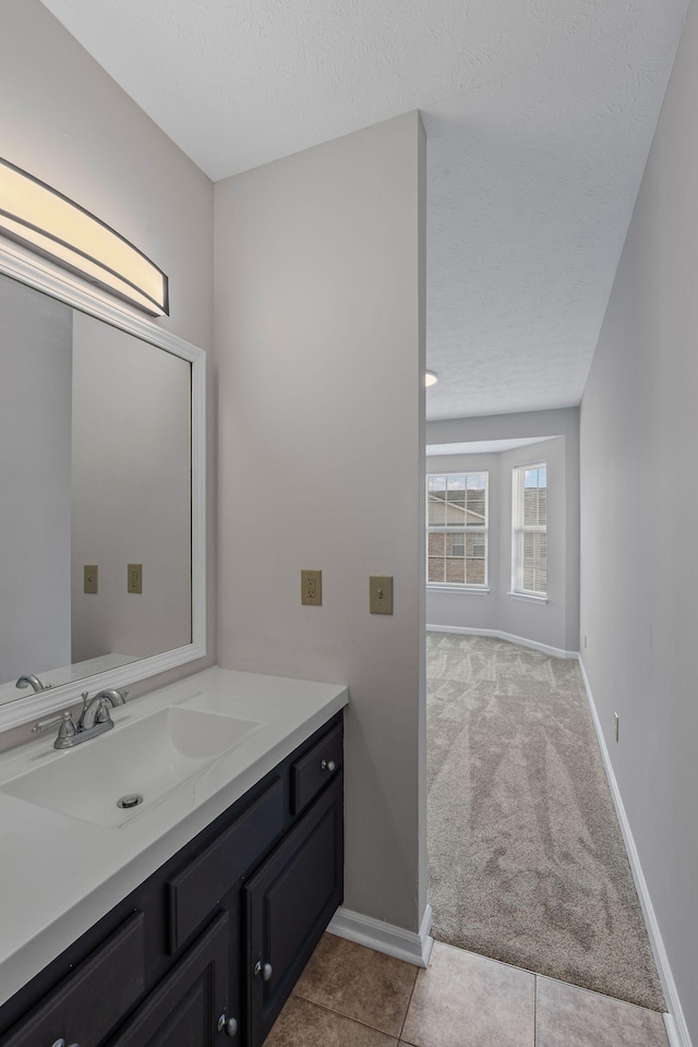 612 Churchill Xing, Madison, TN 37115 - bathroom featuring vanity, baseboards, and a textured ceiling