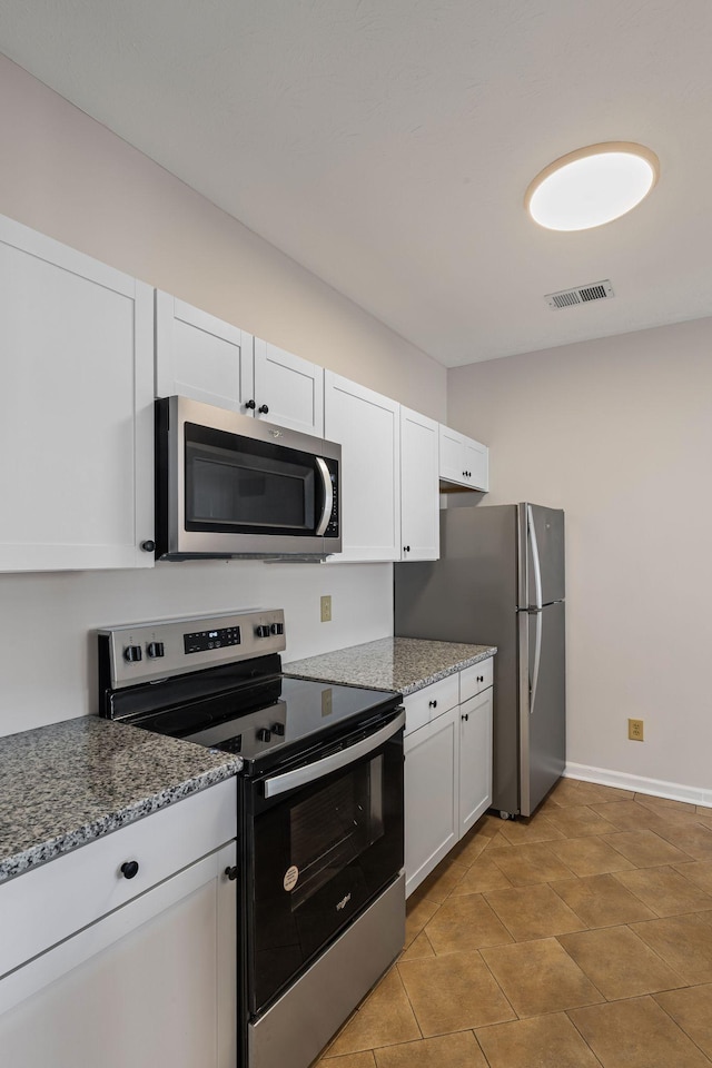 612 Churchill Xing, Madison, TN 37115 - kitchen with appliances with stainless steel finishes, white cabinets, and stone counters