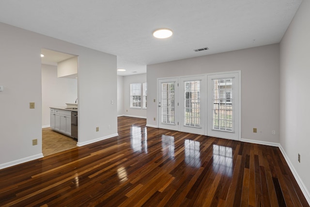 612 Churchill Xing, Madison, TN 37115 - empty room with dark wood finished floors and baseboards