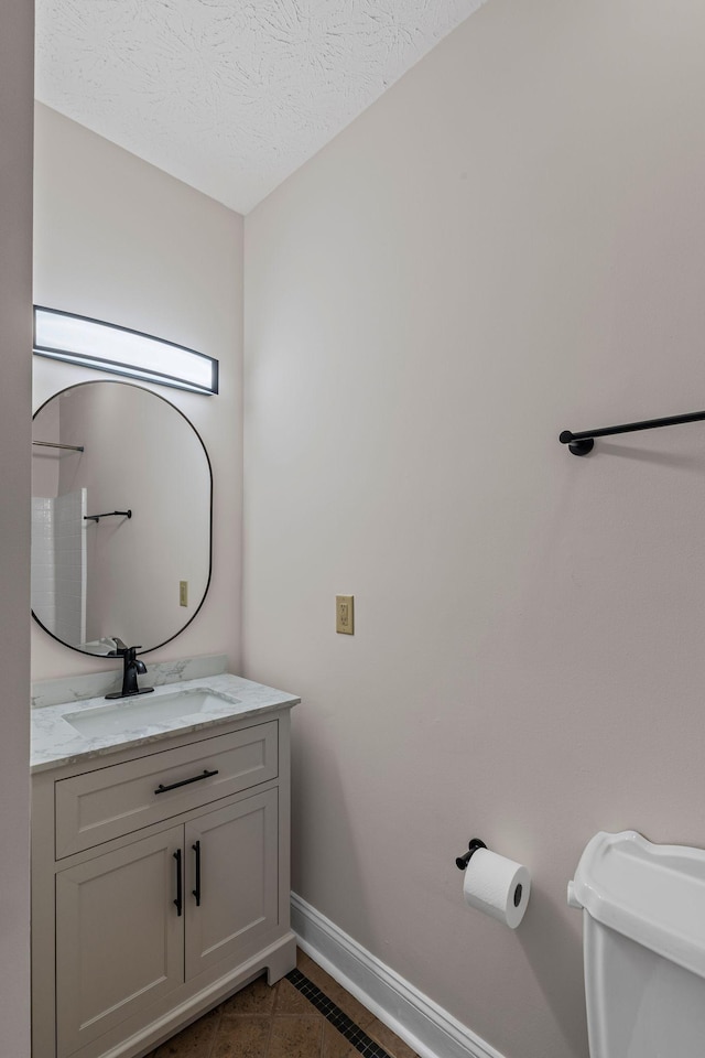 612 Churchill Xing, Madison, TN 37115 - bathroom featuring baseboards, vanity, toilet, tile patterned floors, and a textured ceiling