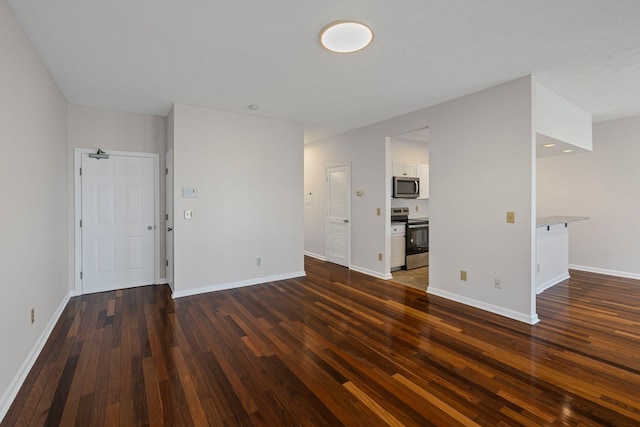 612 Churchill Xing, Madison, TN 37115 - unfurnished living room with dark wood-style floors and baseboards