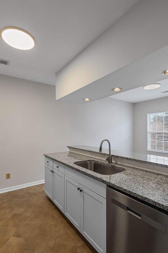 612 Churchill Xing, Madison, TN 37115 - kitchen featuring stainless steel dishwasher, a sink, light stone counters, white cabinetry, and recessed lighting