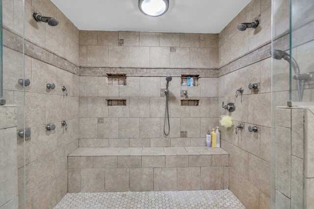 bathroom with a tile shower