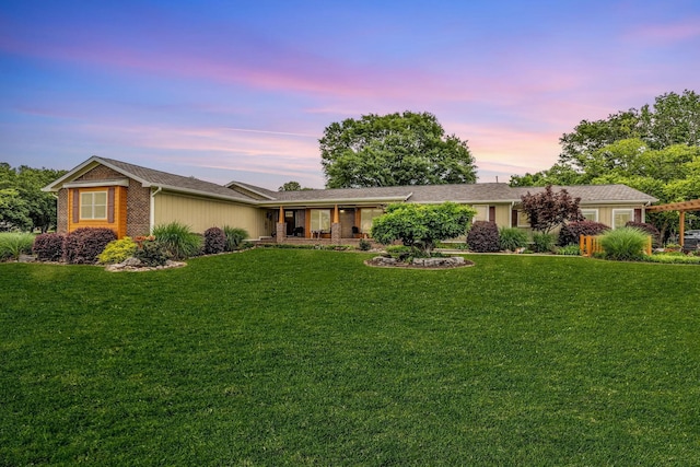ranch-style home with a front lawn