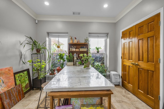 dining area with healthy amount of natural light, ornamental molding, and recessed lighting