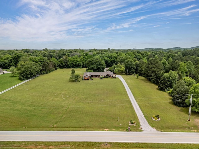 aerial view of sparsely populated area with a heavily wooded area