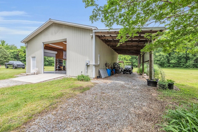 garage with a detached garage and driveway