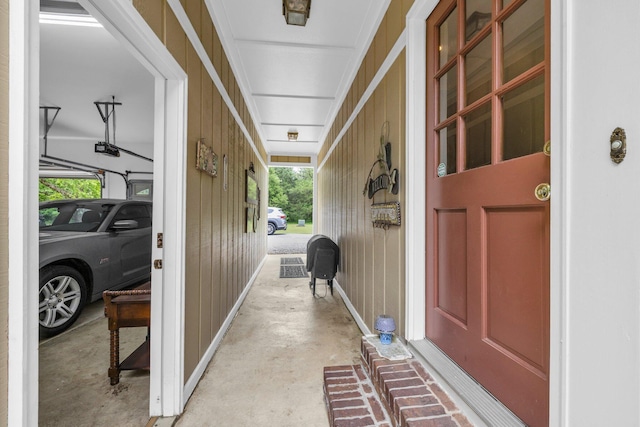 property entrance featuring board and batten siding and covered porch