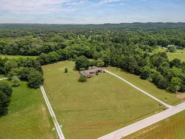 view of rural area featuring a heavily wooded area