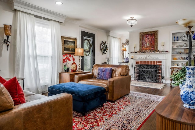 819 N Jefferson Ave, Cookeville, TN 38501 - living area with a fireplace, wood finished floors, ornamental molding, built in features, and recessed lighting