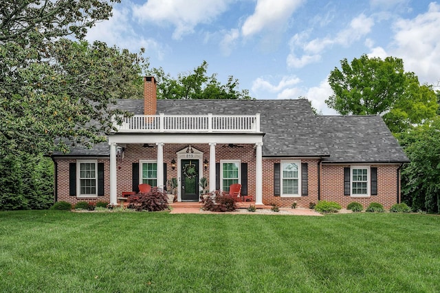 819 N Jefferson Ave, Cookeville, TN 38501 - view of front facade featuring brick siding, a front lawn, a chimney, and a balcony