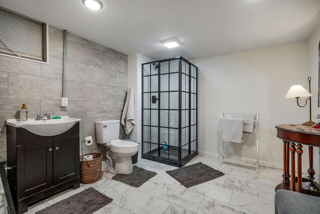 819 N Jefferson Ave, Cookeville, TN 38501 - full bathroom featuring tile walls, a shower stall, marble finish floors, toilet, and vanity