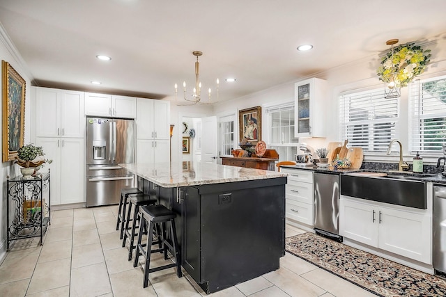 819 N Jefferson Ave, Cookeville, TN 38501 - kitchen with stainless steel fridge with ice dispenser, a sink, a kitchen island, white cabinets, and recessed lighting
