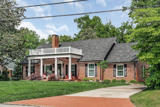 819 N Jefferson Ave, Cookeville, TN 38501 - view of front of home with brick siding, a front lawn, and a chimney
