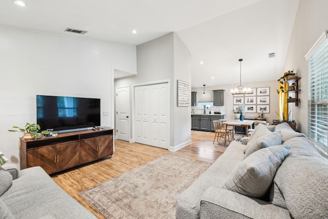 143 Two Mile Pike, Goodlettsville, TN 37072 - living room featuring light wood finished floors, a chandelier, high vaulted ceiling, and recessed lighting
