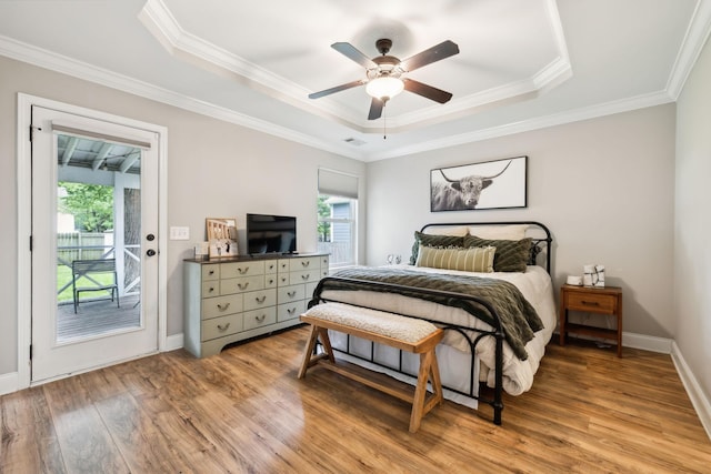 143 Two Mile Pike, Goodlettsville, TN 37072 - bedroom featuring access to exterior, a raised ceiling, light wood finished floors, crown molding, and baseboards