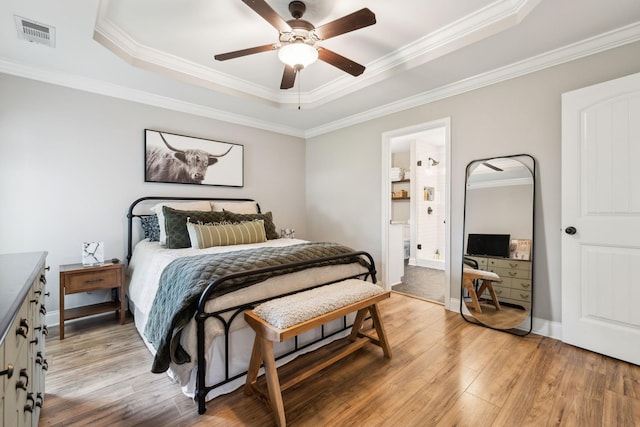 143 Two Mile Pike, Goodlettsville, TN 37072 - bedroom featuring a tray ceiling, light wood-style flooring, ornamental molding, a ceiling fan, and baseboards