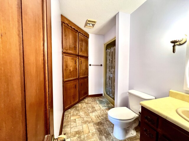 565 E College St, Pulaski, TN 38478 - full bathroom featuring vanity, toilet, a textured ceiling, a shower with curtain, and stone finish flooring