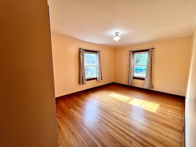 565 E College St, Pulaski, TN 38478 - unfurnished room with ornamental molding, wood finished floors, and baseboards