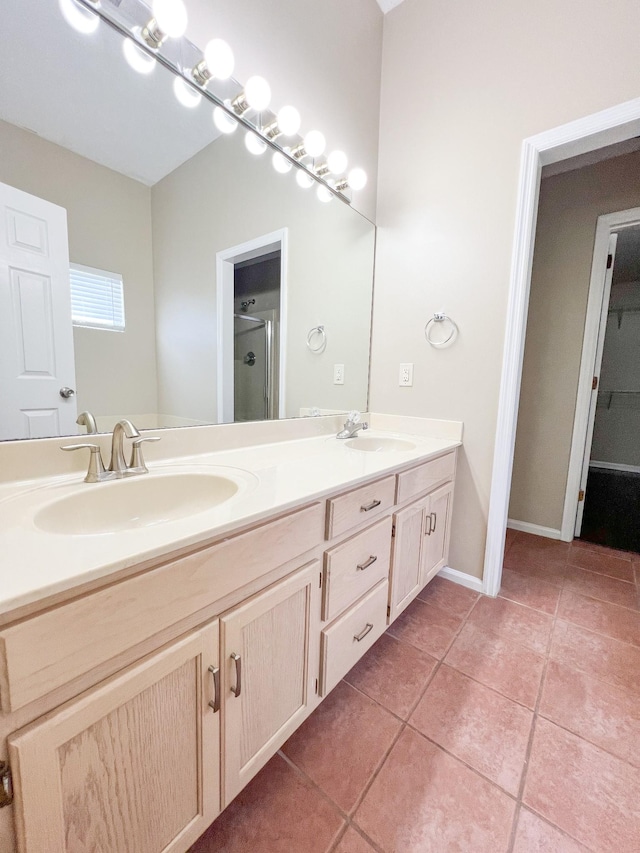 1021 Colo Trl, Antioch, TN 37013 - bathroom featuring tile patterned floors, double vanity, and a shower with shower door