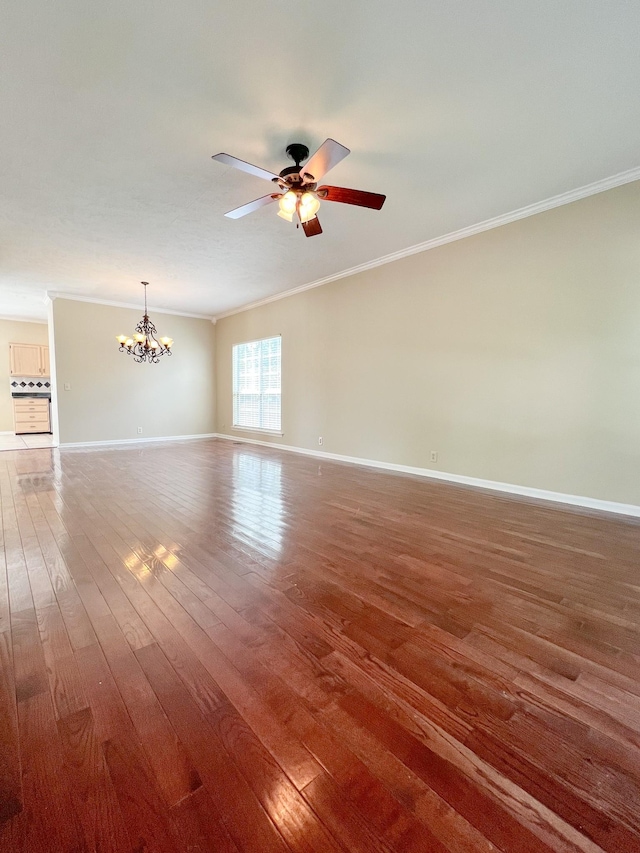 1021 Colo Trl, Antioch, TN 37013 - empty room with crown molding, hardwood / wood-style flooring, a chandelier, a ceiling fan, and baseboards