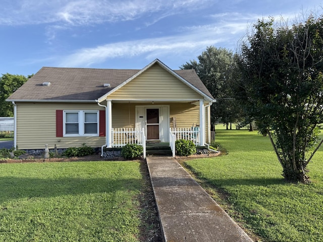 124 Sub Station Rd, Unionville, TN 37180 - bungalow featuring covered porch, a front lawn, and roof with shingles
