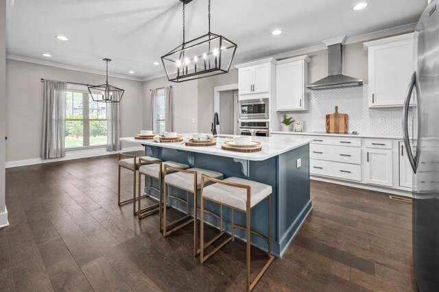 196 Knoxleigh Way, Murfreesboro, TN 37129 - kitchen featuring wall chimney exhaust hood, a chandelier, stainless steel appliances, light countertops, and crown molding