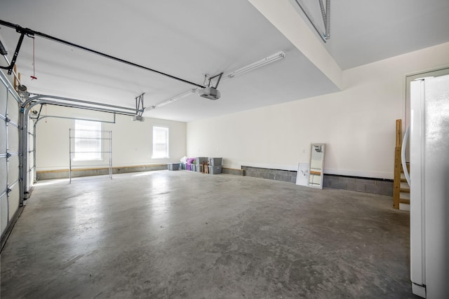 196 Knoxleigh Way, Murfreesboro, TN 37129 - garage with freestanding refrigerator and a garage door opener