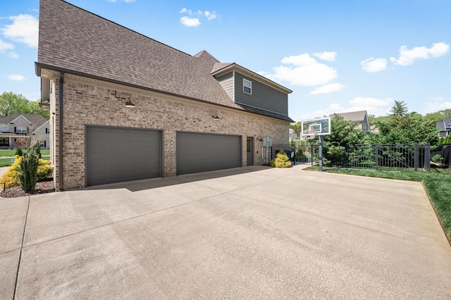 196 Knoxleigh Way, Murfreesboro, TN 37129 - view of home's exterior with brick siding, concrete driveway, fence, and roof with shingles