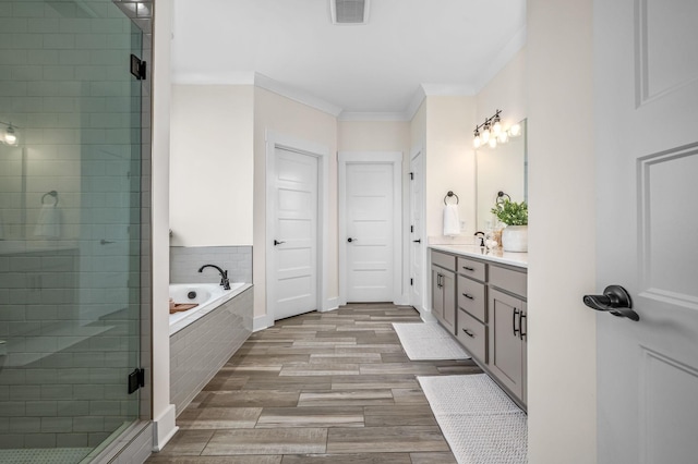 196 Knoxleigh Way, Murfreesboro, TN 37129 - bathroom featuring a shower stall, ornamental molding, vanity, a bath, and wood finished floors