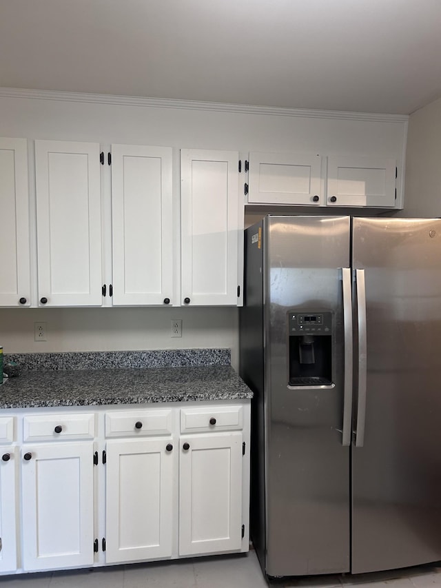 314 Powder Mill Dr, Ashland City, TN 37015 - kitchen featuring stainless steel fridge, white cabinets, dark stone counters, and ornamental molding