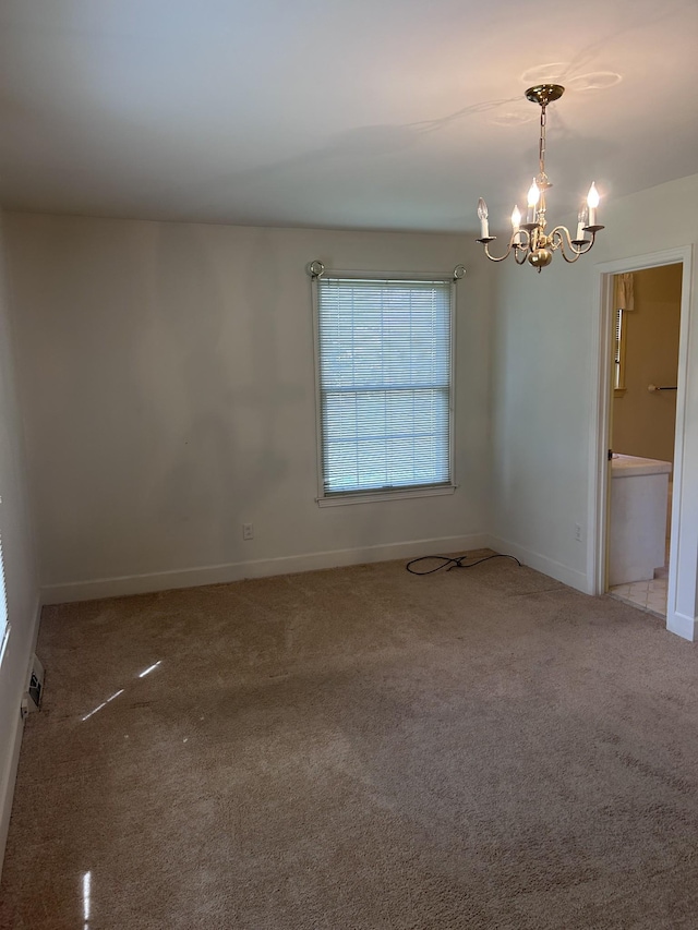314 Powder Mill Dr, Ashland City, TN 37015 - spare room with a chandelier, carpet floors, and baseboards