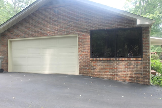 314 Powder Mill Dr, Ashland City, TN 37015 - view of side of property with brick siding, driveway, and an attached garage