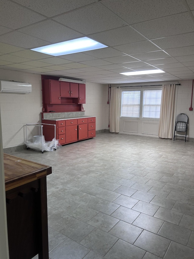 314 Powder Mill Dr, Ashland City, TN 37015 - kitchen with red cabinets, a wall unit AC, concrete block wall, and a drop ceiling