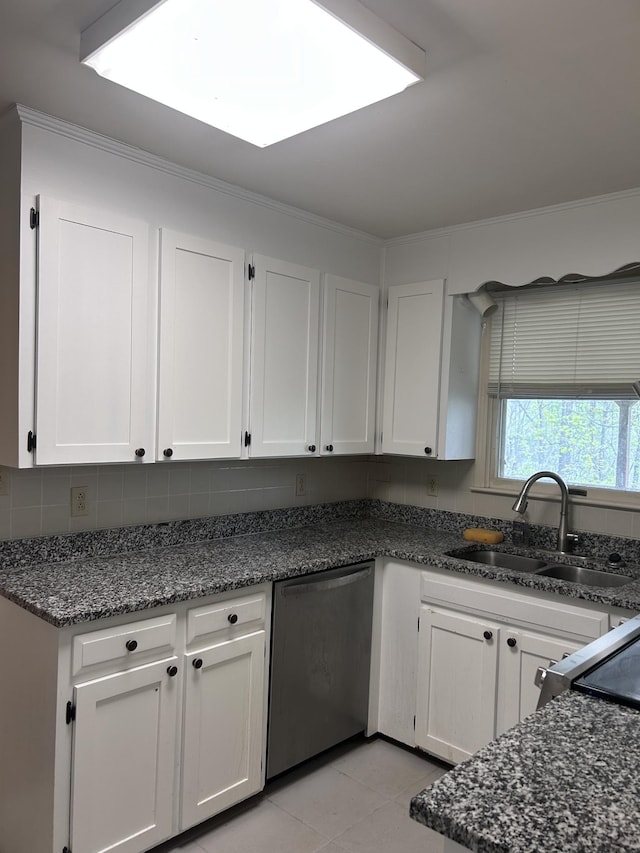 314 Powder Mill Dr, Ashland City, TN 37015 - kitchen featuring stainless steel dishwasher, a sink, white cabinets, dark stone countertops, and light tile patterned flooring