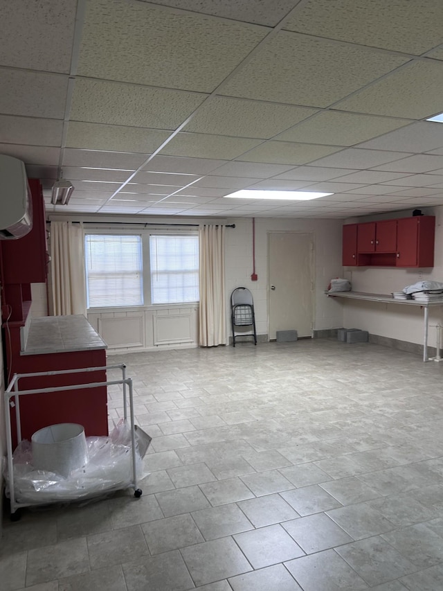 314 Powder Mill Dr, Ashland City, TN 37015 - basement featuring an AC wall unit and a paneled ceiling