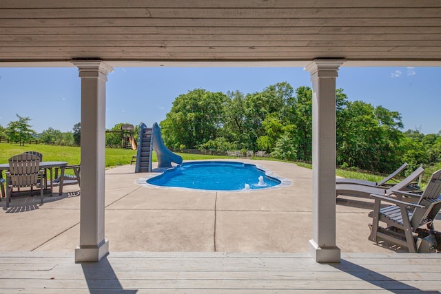 4095 Indian Hills Rd, Columbia, TN 38401 - swimming pool featuring a water slide, a patio, a fenced backyard, and view of scattered trees