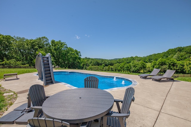 4095 Indian Hills Rd, Columbia, TN 38401 - swimming pool with a patio, a view of trees, and outdoor dining area