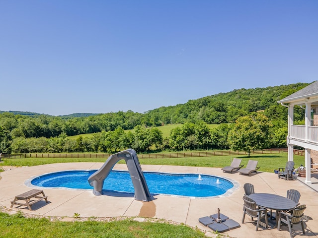 4095 Indian Hills Rd, Columbia, TN 38401 - view of pool featuring a view of trees, a water slide, and a patio area