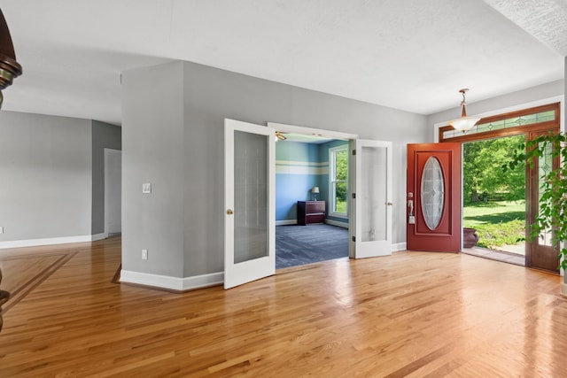 4095 Indian Hills Rd, Columbia, TN 38401 - foyer entrance with french doors, baseboards, and wood finished floors