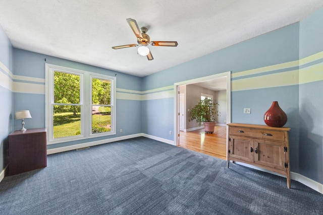 4095 Indian Hills Rd, Columbia, TN 38401 - unfurnished bedroom featuring carpet flooring, multiple windows, baseboards, and ceiling fan