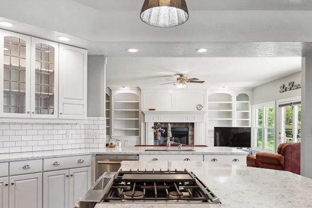 4095 Indian Hills Rd, Columbia, TN 38401 - kitchen featuring a ceiling fan, open floor plan, a tile fireplace, light stone counters, and recessed lighting