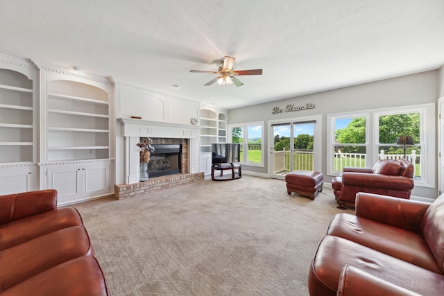4095 Indian Hills Rd, Columbia, TN 38401 - living area featuring a ceiling fan, a fireplace, carpet flooring, a textured ceiling, and built in features