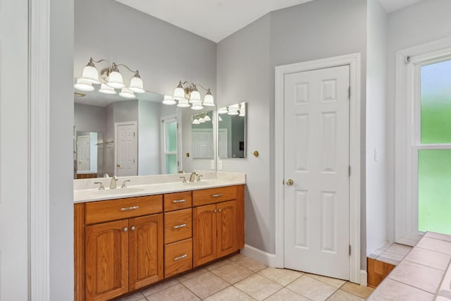 4095 Indian Hills Rd, Columbia, TN 38401 - full bathroom featuring double vanity, tile patterned flooring, and baseboards