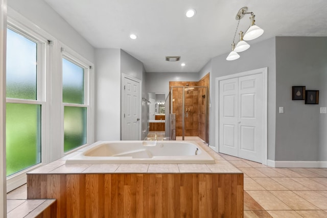 4095 Indian Hills Rd, Columbia, TN 38401 - full bath featuring a bath, a stall shower, healthy amount of natural light, tile patterned flooring, and recessed lighting