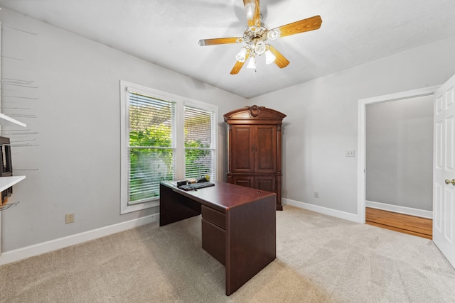 4095 Indian Hills Rd, Columbia, TN 38401 - home office with light colored carpet, a ceiling fan, and baseboards