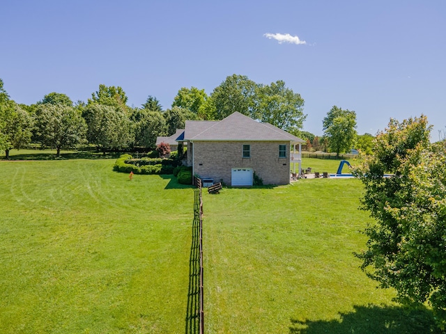 4095 Indian Hills Rd, Columbia, TN 38401 - view of green lawn featuring an attached garage