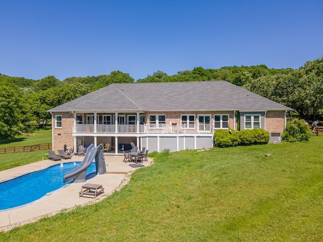 4095 Indian Hills Rd, Columbia, TN 38401 - back of property with an outdoor pool, a patio, brick siding, and a balcony
